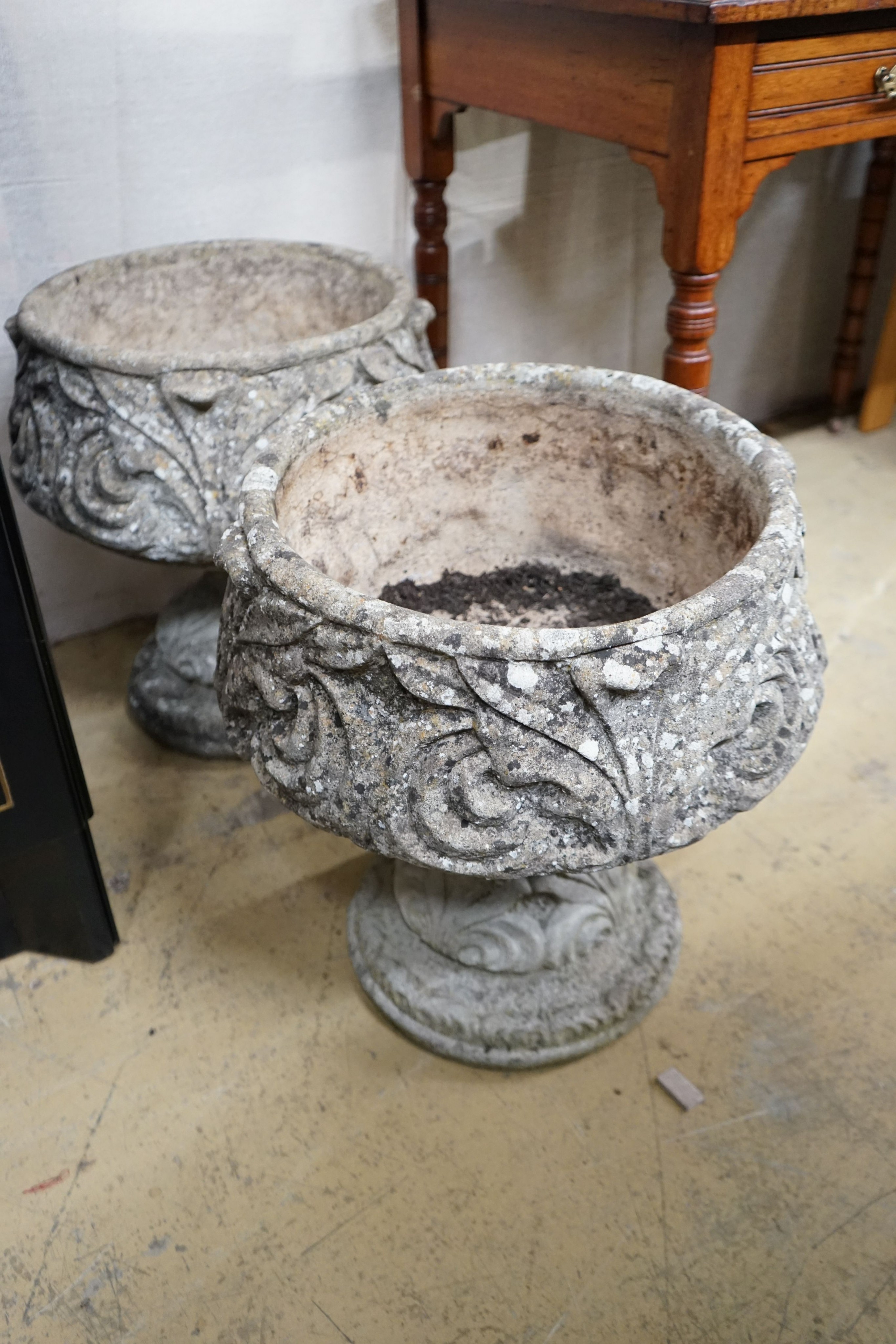 A pair of reconstituted stone circular garden planters, diameter 45cm, height 48cm